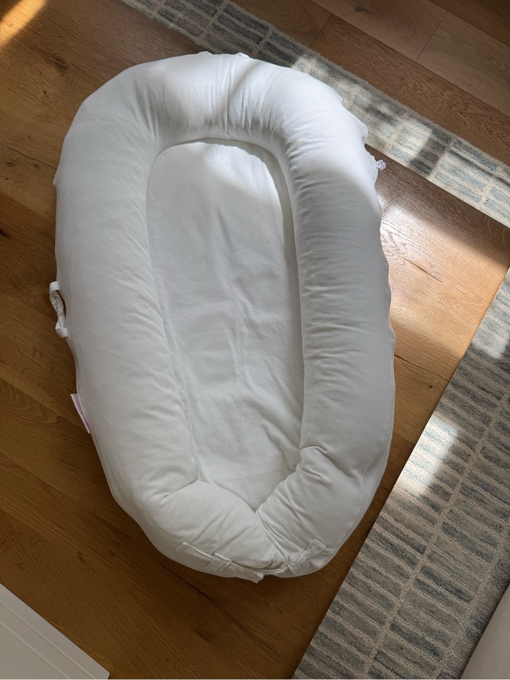 Dockatot Deluxe with white Courderoy cover